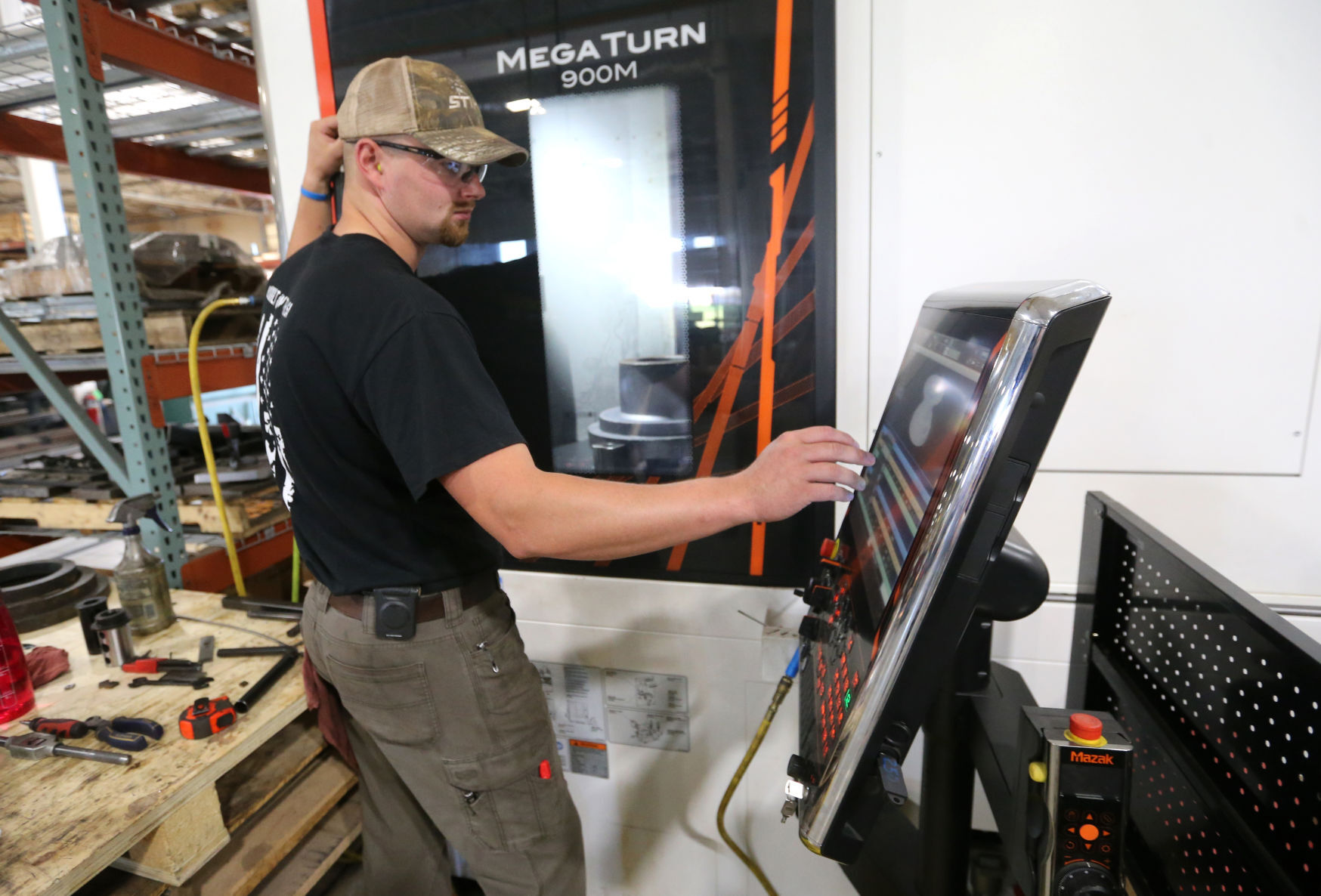 Colten Wessels processes a piece of metal at Digga North America in Dyersville, Iowa.    PHOTO CREDIT: JESSICA REILLY