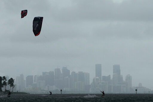 Kite surfers take advantage of strong winds caused by distant Hurricane Ian, at Matheson Hammock Park in Coral Gables, Fla. Tuesday, Sept. 27, 2022. Miami