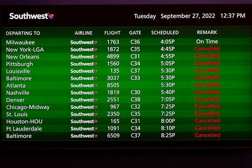 Canceled flights are shown on a video board at the Southwest Airlines ticket counter at the Tampa International Airport Tuesday, Sept. 27, 2022, in Tampa, Fla. The airport is closing at 5pm EST today ahead of a planned landfall by Hurricane Ian. Ian is predicted to make landfall somewhere along Florida