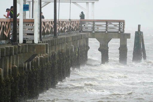 Waves crash along the Ballast Point Pier ahead of Hurricane Ian, Wednesday, Sept. 28, 2022, in Tampa, Fla. The U.S. National Hurricane Center says Ian