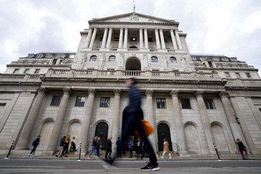 A man man passes the Bank of England in London, Wednesday, Sept. 28, 2022. The Bank of England has launched a temporary bond-buying programme as it takes emergency action to prevent "material risk" to UK financial stability. (AP Photo/Frank Augstein)    PHOTO CREDIT: Frank Augstein