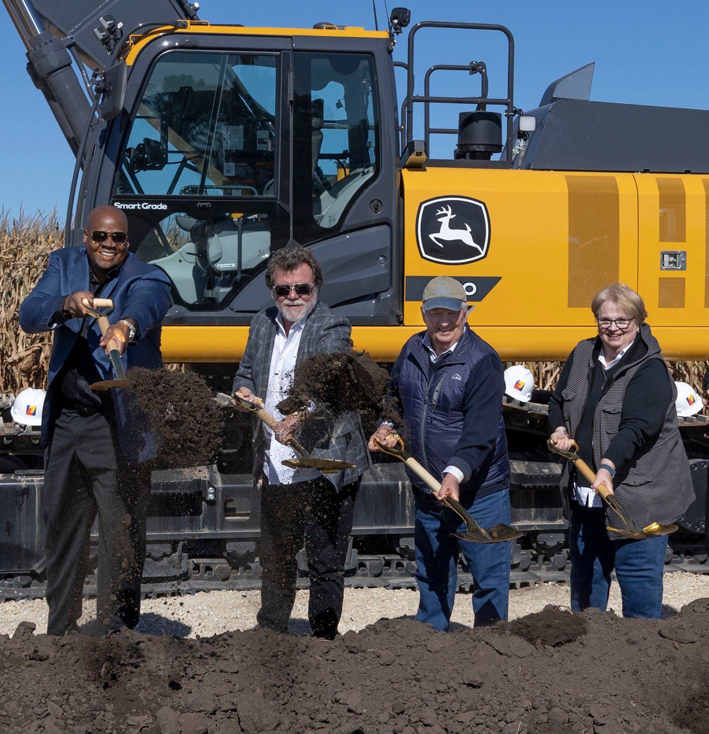 (From left) Frank Thomas, CEO of Go the Distance Baseball; Rick Heidner, investor, Go the Distance Baseball; and former Field of Dreams owners Don Lansing and Becky Lansing shovel dirt during the Project Heaven groundbreaking ceremony Wednesday at the Field of Dreams in Dyersville, Iowa.    PHOTO CREDIT: Stephen Gassman