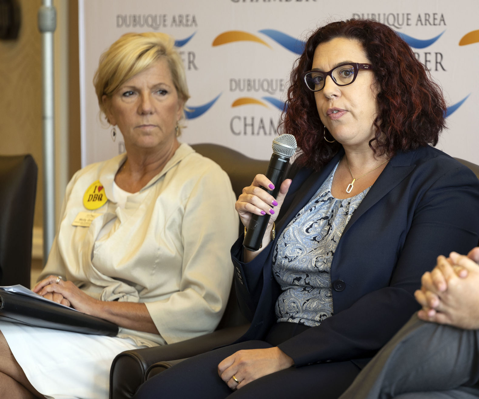 Molly Grover, president and CEO of Dubuque Area Chamber of Commerce, listens as Allison Dembeck speaks during a panel discussion. Dembeck is the vice president of government affairs for the U.S. Chamber of Commerce.    PHOTO CREDIT: Stephen Gassman