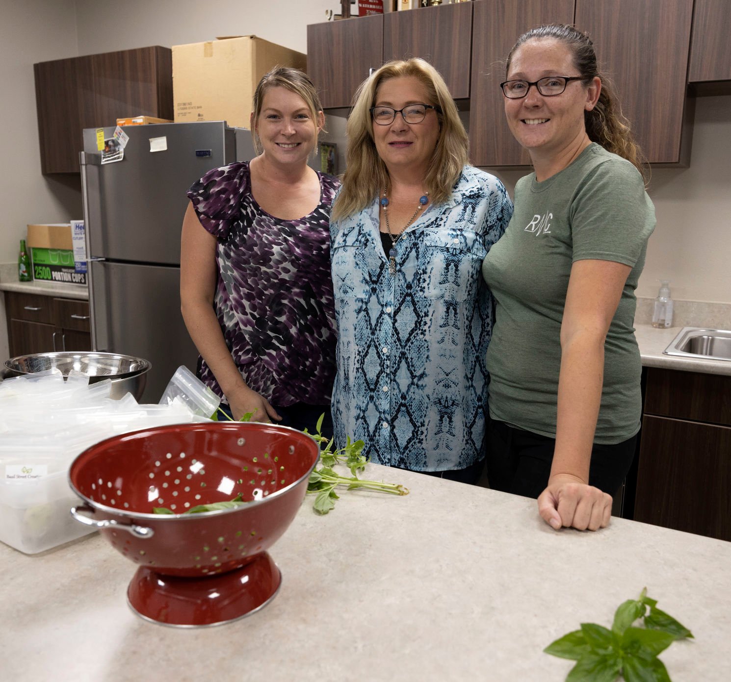 Samantha Koppes (from left), Jill Wagener and Kayla Wagener own Basil Street Creations. The Hopkinton, Iowa, family business focuses on basil. Their products are at farmers markets and a store in Maquoketa, Iowa.    PHOTO CREDIT: Stephen Gassman