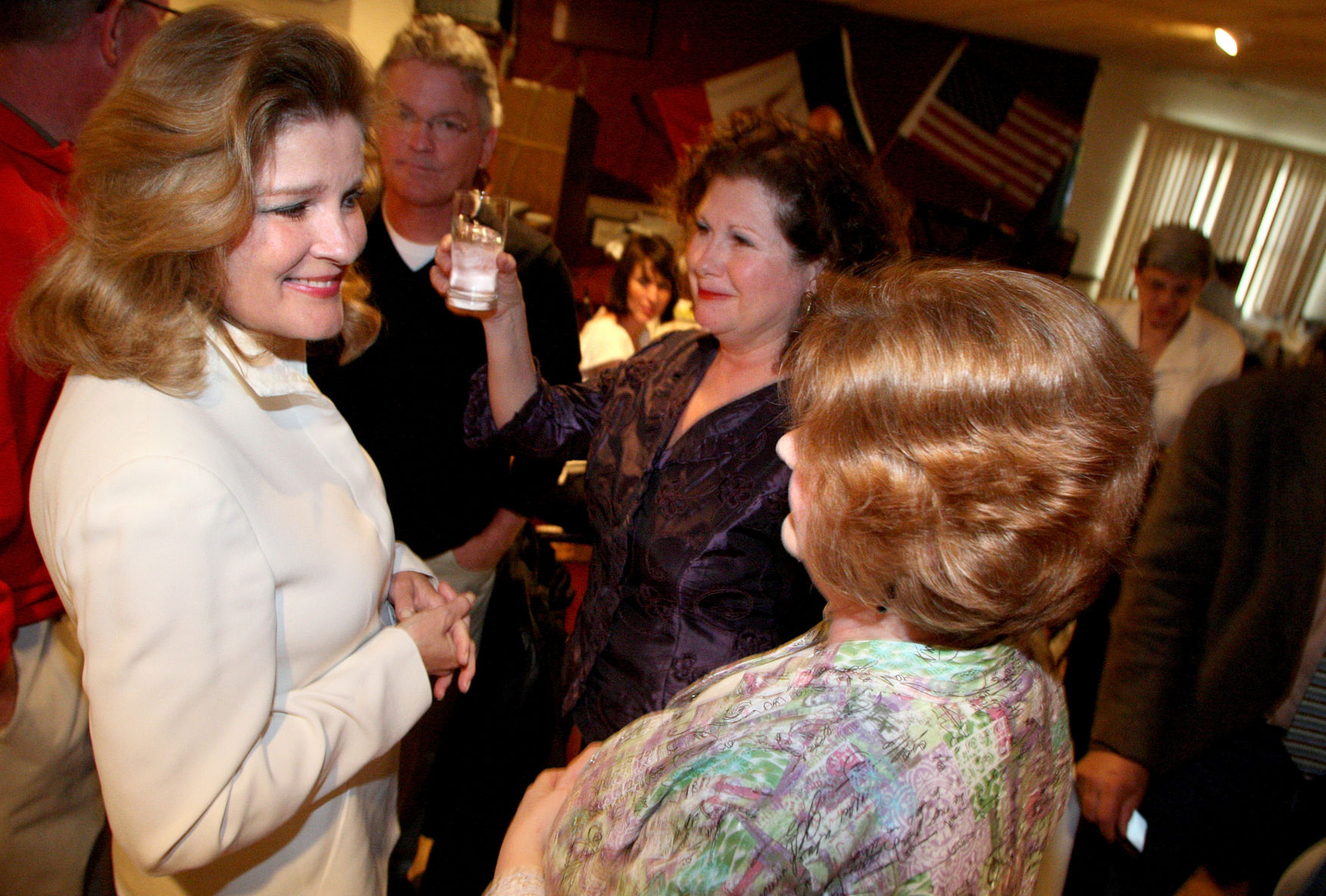 Actress Kate Mulgrew (left) talks with Teri Hawks Goodmann (middle) and Suellen Flynn during the 2009 Hall of Fame Awards Banquet at Happy’s Place in Dubuque.    PHOTO CREDIT: File photo
