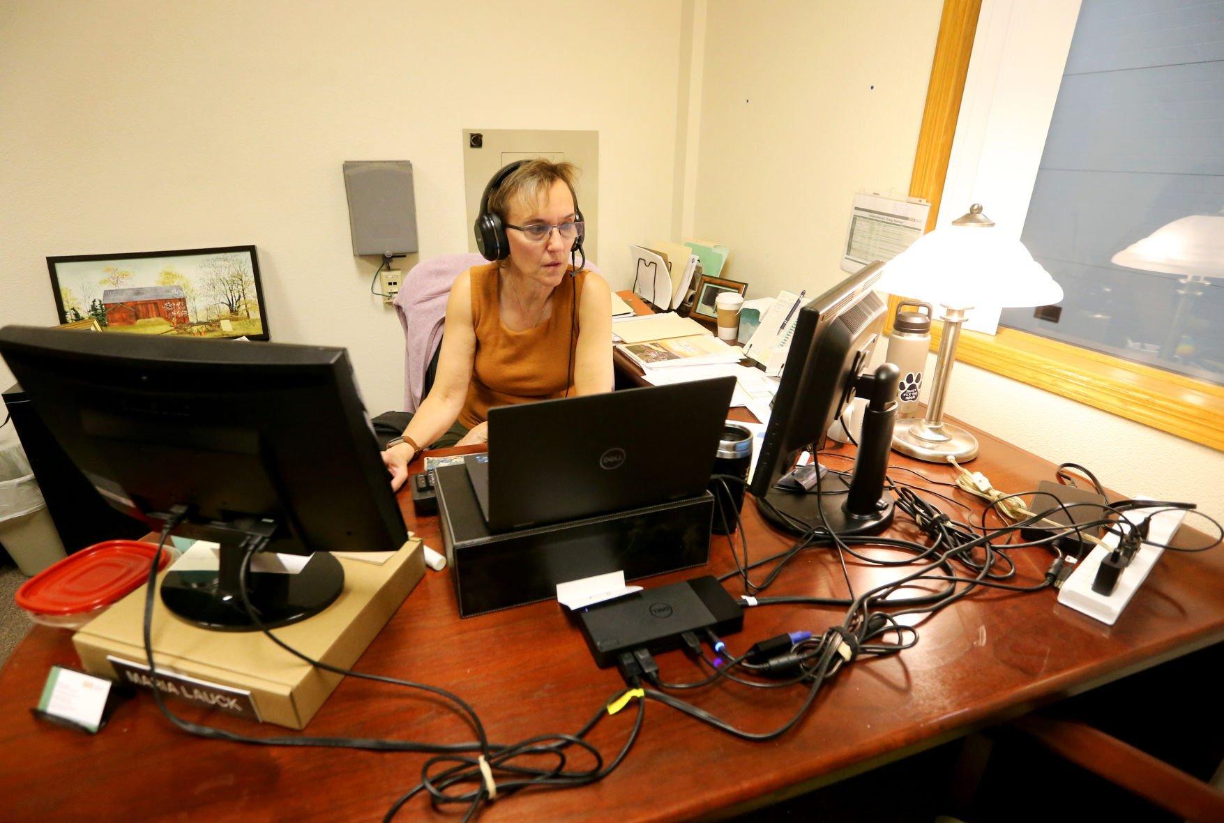 Maria Lauck, with Power Systems, talks to a client on the phone at Platteville (Wis.) Business Incubator.    PHOTO CREDIT: JESSICA REILLY