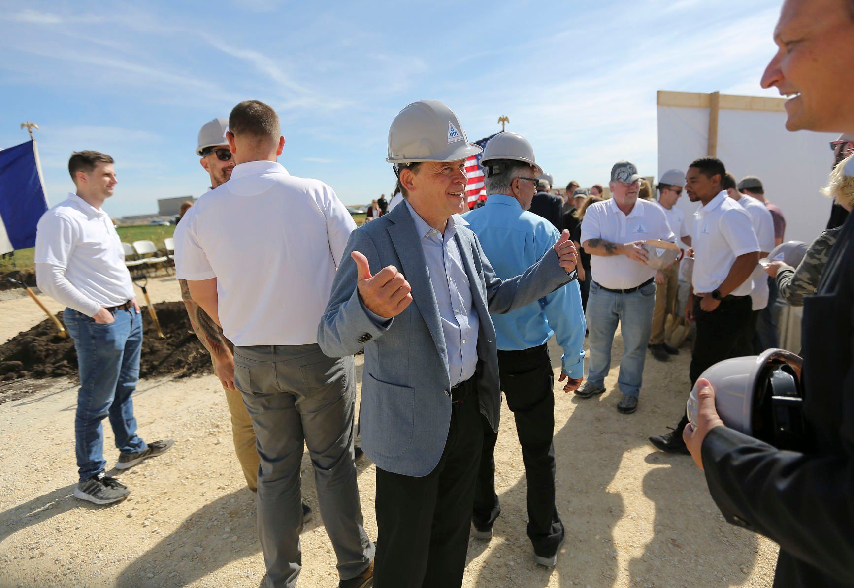 Wolfgang Buehler, co-owner of Ancient Brands Milling, chats with attendees after a groundbreaking event on Tuesday, Oct. 4, 2022. The manufacturer, which makes organic and non-GMO puffed grains, has planned a $26.5 million, 92,000-square-foot project in Dyersville’s 20 West Industrial Park.    PHOTO CREDIT: Dave Kettering