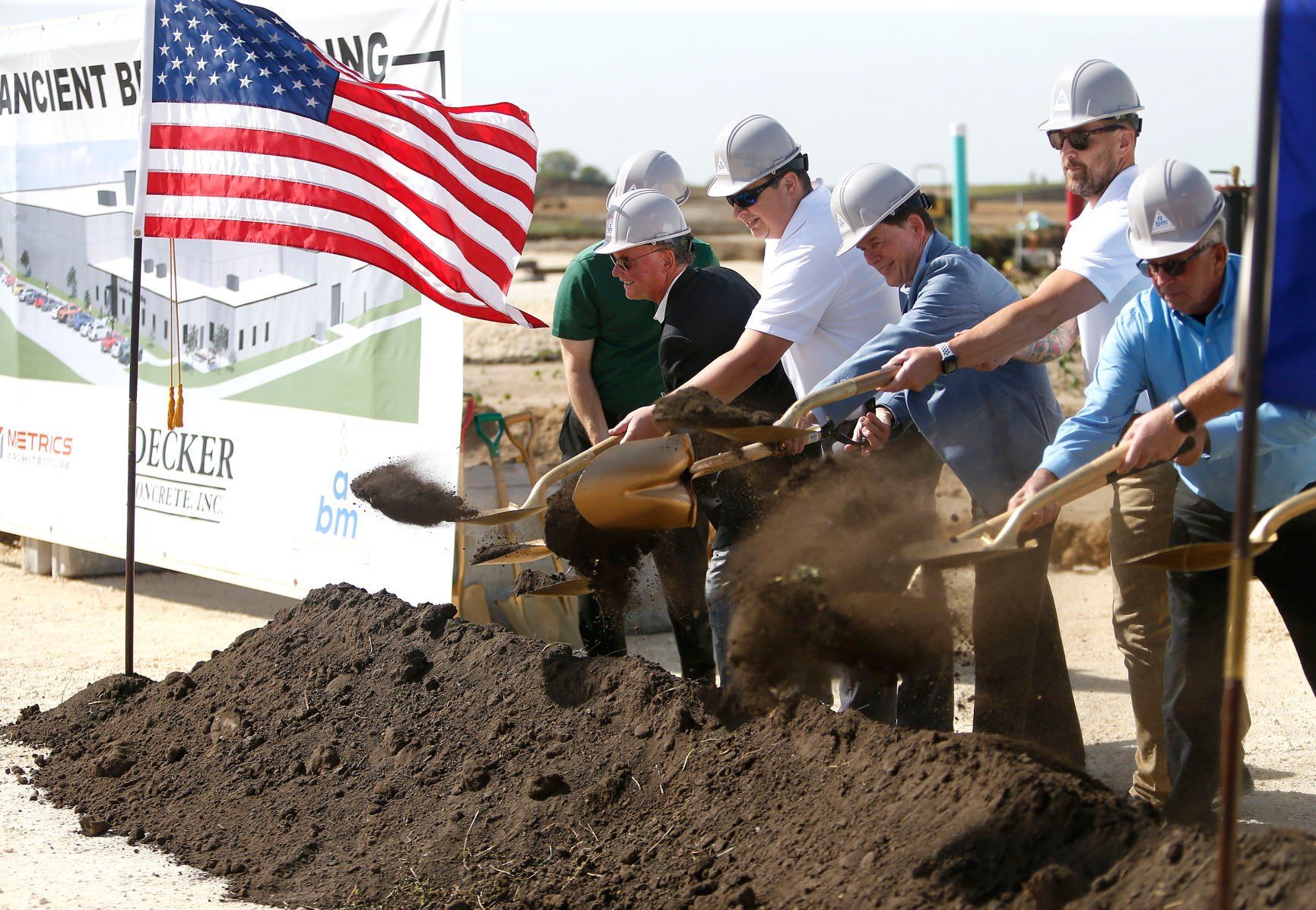 Representatives take part in a groundbreaking event for Ancient Brands Milling on Tuesday, Oct. 4, 2022. The manufacturer, which makes organic and non-GMO puffed grains, has planned a $26.5 million, 92,000-square-foot project in Dyersville’s 20 West Industrial Park.    PHOTO CREDIT: Dave Kettering