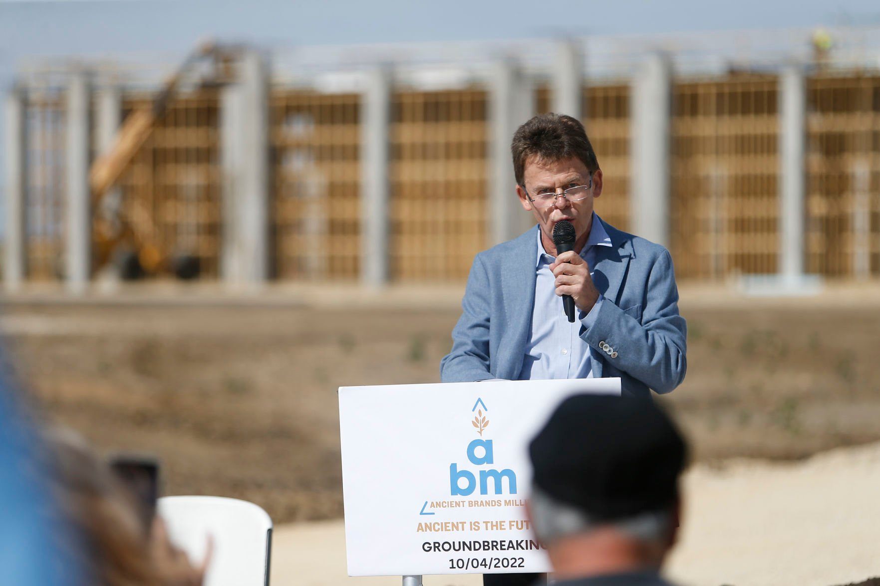 Wolfgang Buehler, co-owner of Ancient Brands Milling, speaks during a groundbreaking event on Tuesday, Oct. 4, 2022. The manufacturer, which makes organic and non-GMO puffed grains, has planned a $26.5 million, 92,000-square-foot project in Dyersville’s 20 West Industrial Park.    PHOTO CREDIT: Dave Kettering