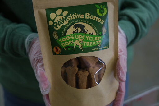 A package of Pawsitive Bones, a dog treat, produced by Food Shift, made of ingredients that are usually discarded, is shown Tuesday, Sept. 13, 2022 in Alameda, California. "Best before” labels are coming under scrutiny as concerns about food waste grow around the world. Manufacturers have used the labels for decades to estimate peak freshness. But “best before” labels have nothing to do with safety, and some worry they encourage consumers to throw away food that’s perfectly fine to eat. (AP Photo/Terry Chea)    PHOTO CREDIT: Terry Chea