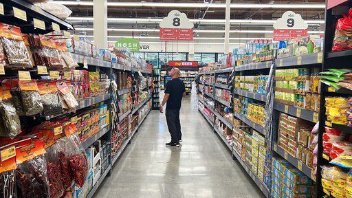 Customer Kevin Amaral shops at a Grocery Outlet store in Pleasanton, Calif., on Thursday, Sept. 15, 2022. "Best before” labels are coming under scrutiny as concerns about food waste grow around the world. Manufacturers have used the labels for decades to estimate peak freshness. But “best before” labels have nothing to do with safety, and some worry they encourage consumers to throw away food that’s perfectly fine to eat. (AP Photo/Terry Chea)    PHOTO CREDIT: Terry Chea