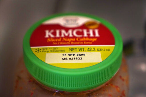 A date is stamped on a container of Kimchi, Sunday, Aug. 21, 2022, in Chicago. As awareness grows around the world about the problem of food waste, one culprit in particular is drawing scrutiny: “best before” labels. Manufacturers have used the labels for decades to estimate peak freshness. Unlike “use by” labels, which are found on perishable foods like meat and dairy, “best before” labels have nothing to do with safety and may encourage consumers to throw away food that’s perfectly fine to eat. (AP Photo/Charles Rex Arbogast)    PHOTO CREDIT: Charles Rex Arbogast
