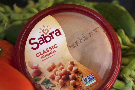 A "best before" date is seen on a container of hummus, Saturday, Aug. 20, 2022, in Boston. As awareness grows around the world about the problem of food waste, one culprit in particular is drawing scrutiny: “best before” labels. Manufacturers have used the labels for decades to estimate peak freshness. Unlike “use by” labels, which are found on perishable foods like meat and dairy, “best before” labels have nothing to do with safety and may encourage consumers to throw away food that’s perfectly fine to eat. (AP Photo/Michael Dwyer)    PHOTO CREDIT: Michael Dwyer