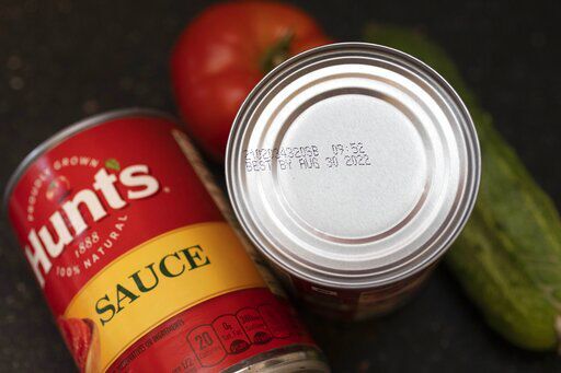 A "best by" date is seen on the top of a tomato sauce can, Saturday, Aug. 20, 2022, in Boston. As awareness grows around the world about the problem of food waste, one culprit in particular is drawing scrutiny: “best before” labels. Manufacturers have used the labels for decades to estimate peak freshness. Unlike “use by” labels, which are found on perishable foods like meat and dairy, “best before” labels have nothing to do with safety and may encourage consumers to throw away food that’s perfectly fine to eat. (AP Photo/Michael Dwyer)    PHOTO CREDIT: Michael Dwyer