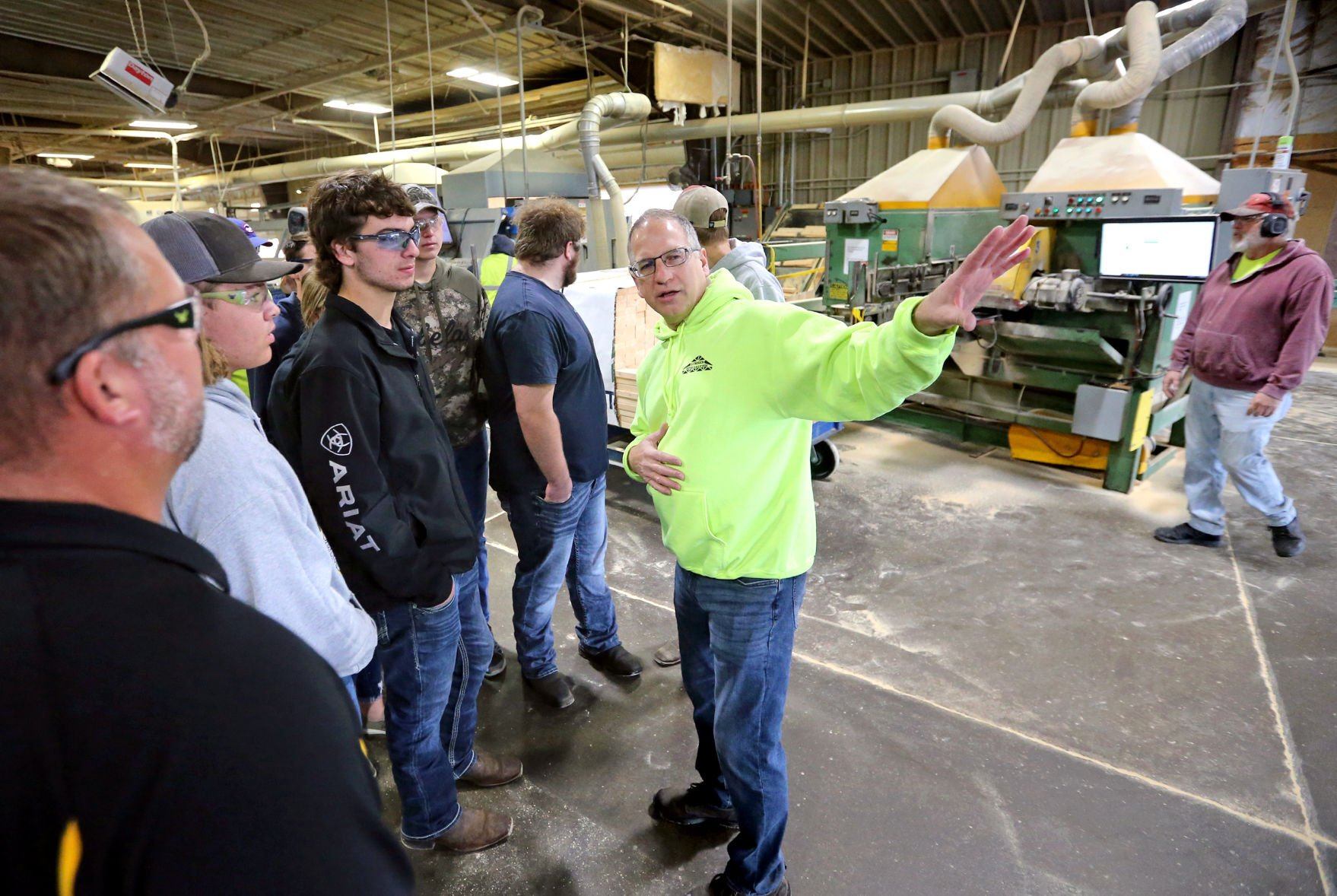 Bob Stewart, operations manager at Lumber Specialties, talks to Maquoketa Valley High School students during a tour of the facility in Dyersville, Iowa, on Thursday, Oct. 6, 2022, as part of Manufacturing Day sponsored by Dyersville Economic Development.    PHOTO CREDIT: JESSICA REILLY