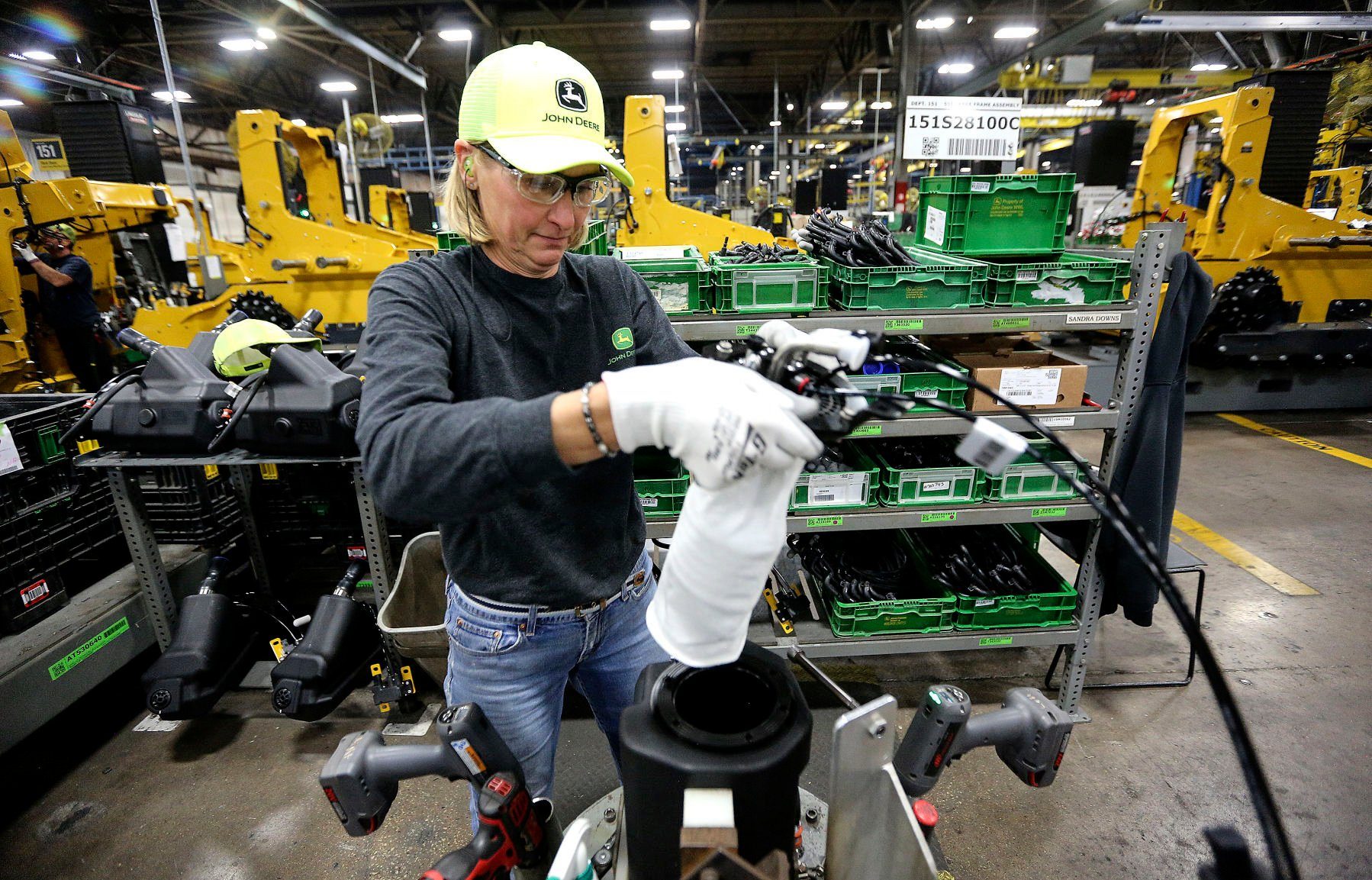 John Deere Dubuque Works employee Sandra Downs works on assembling fuel, hydraulics, and DEF (Diesel Exhaust Fluid) tanks on Friday, Oct. 7, 2022.    PHOTO CREDIT: Dave Kettering