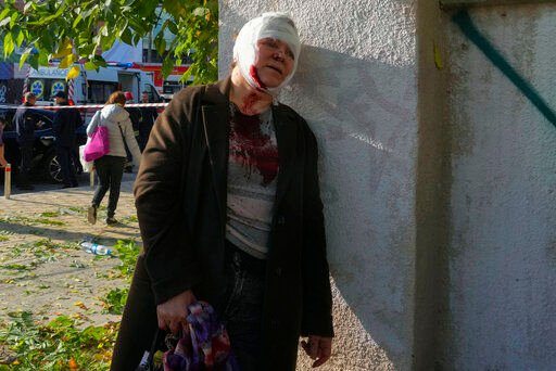 An injured woman reacts after Russian shelling, in Kyiv, Ukraine. Two explosions rocked Kyiv early today following months of relative calm in the Ukrainian capital.    PHOTO CREDIT: Efrem Lukatsky