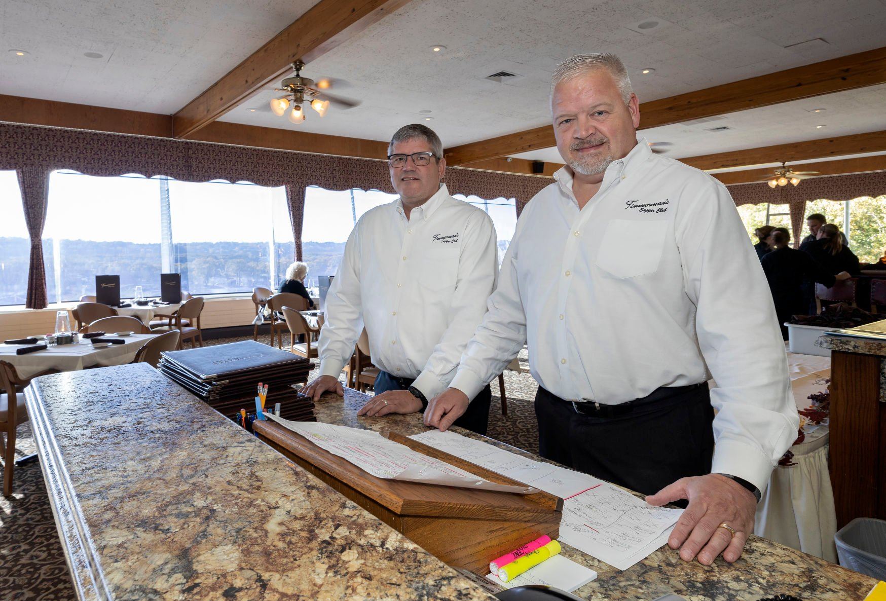 Timmerman’s Supper Club owners Gary Neuses (left) and Mark Hayes took over the East Dubuque, Ill., restaurant in 2003. Helen and Bob Timmerman opened the self-named establishment in 1961 on a bluff east of the town.    PHOTO CREDIT: Stephen Gassman
