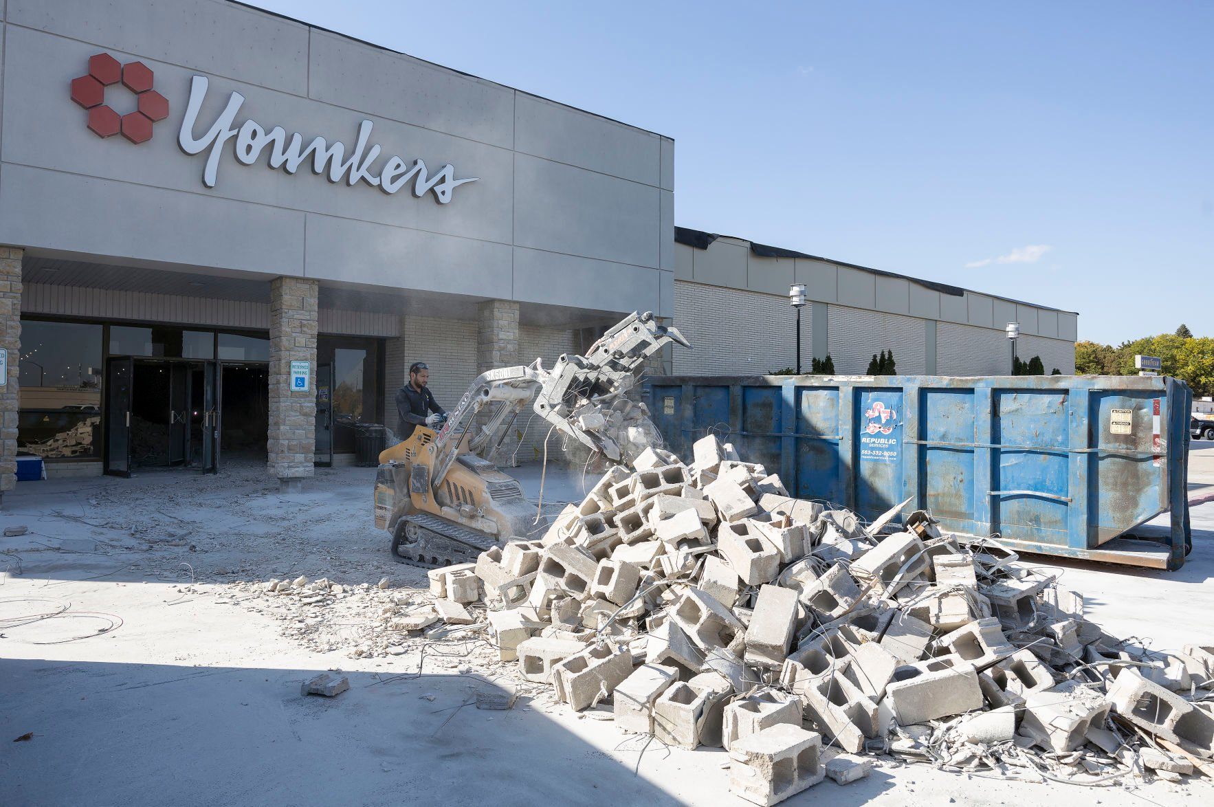 Construction crews work on clearing out the former Younkers women