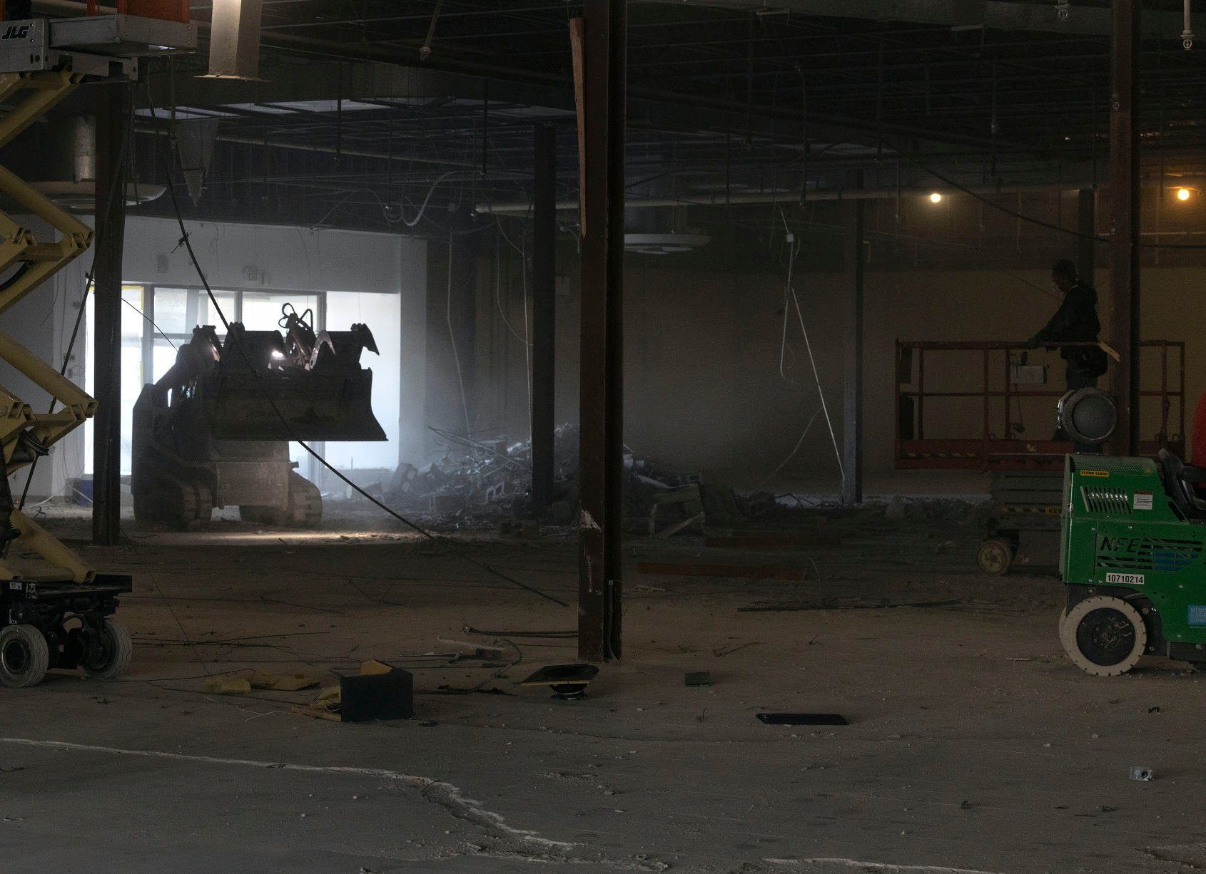 Construction crews work on clearing out the former Younkers women