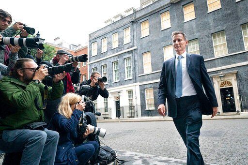 Jeremy Hunt leaves 10 Downing Street in London. Hunt today reversed most of an economic package announced by the government just weeks ago, including a planned cut to income tax.    PHOTO CREDIT: Stefan Rousseau