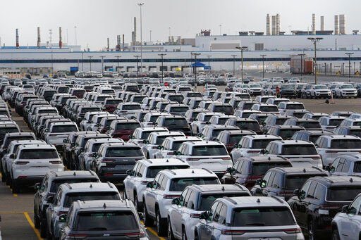 New vehicles are shown parked in storage lots near the the Stellantis Detroit Assembly Complex in Detroit. Over the past few years, thieves have driven new vehicles from automaker storage lots and dealerships across the Detroit area.    PHOTO CREDIT: Paul Sancya