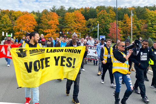 Amazon workers and supporters march during a rally in Castleton-On-Hudson, about 15 miles south of Albany, N.Y. The startup union that clinched a historic labor victory at Amazon earlier this year is slated to face the company yet again, aiming to rack up more wins that could force the reluctant retail behemoth to the negotiating table.    PHOTO CREDIT: Rachel Phua