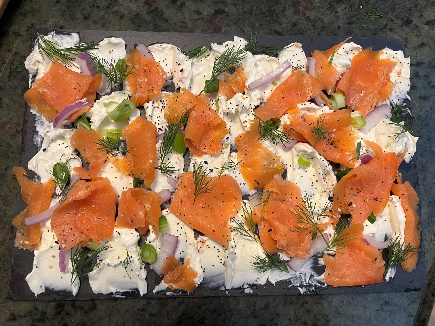 <p>This October 2022 photo shows a cream cheese and smoked salmon board created by Suzie Cornell in Boca Raton, Fla. Butter boards have become the polarizing stepchild of charcuterie boards. (Suzie Cornell via AP)</p>   PHOTO CREDIT: Uncredited - honsx, Sizie Cornell