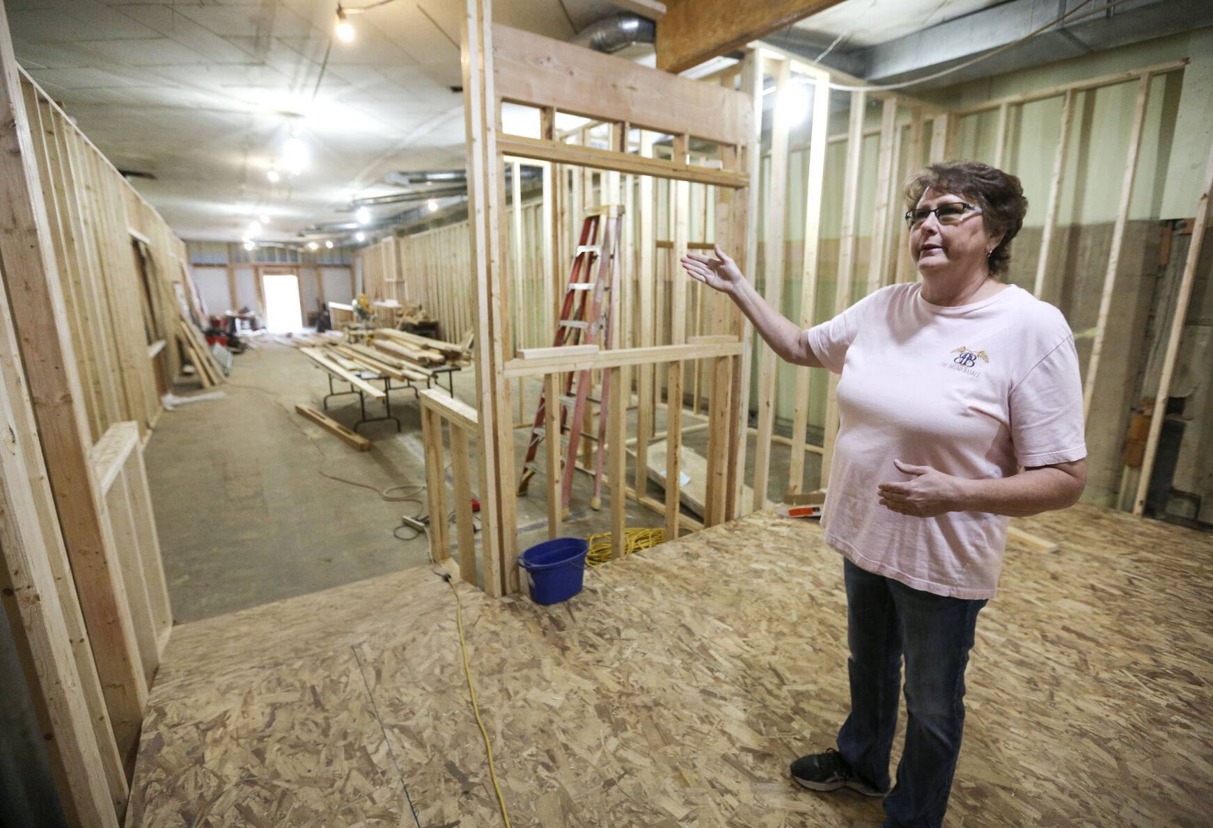 Owner Jackie Mormann stands in what will be the kitchen area of The Bread Basket located in Manchester, Iowa, on Friday, Oct. 28, 2022.    PHOTO CREDIT: Dave Kettering