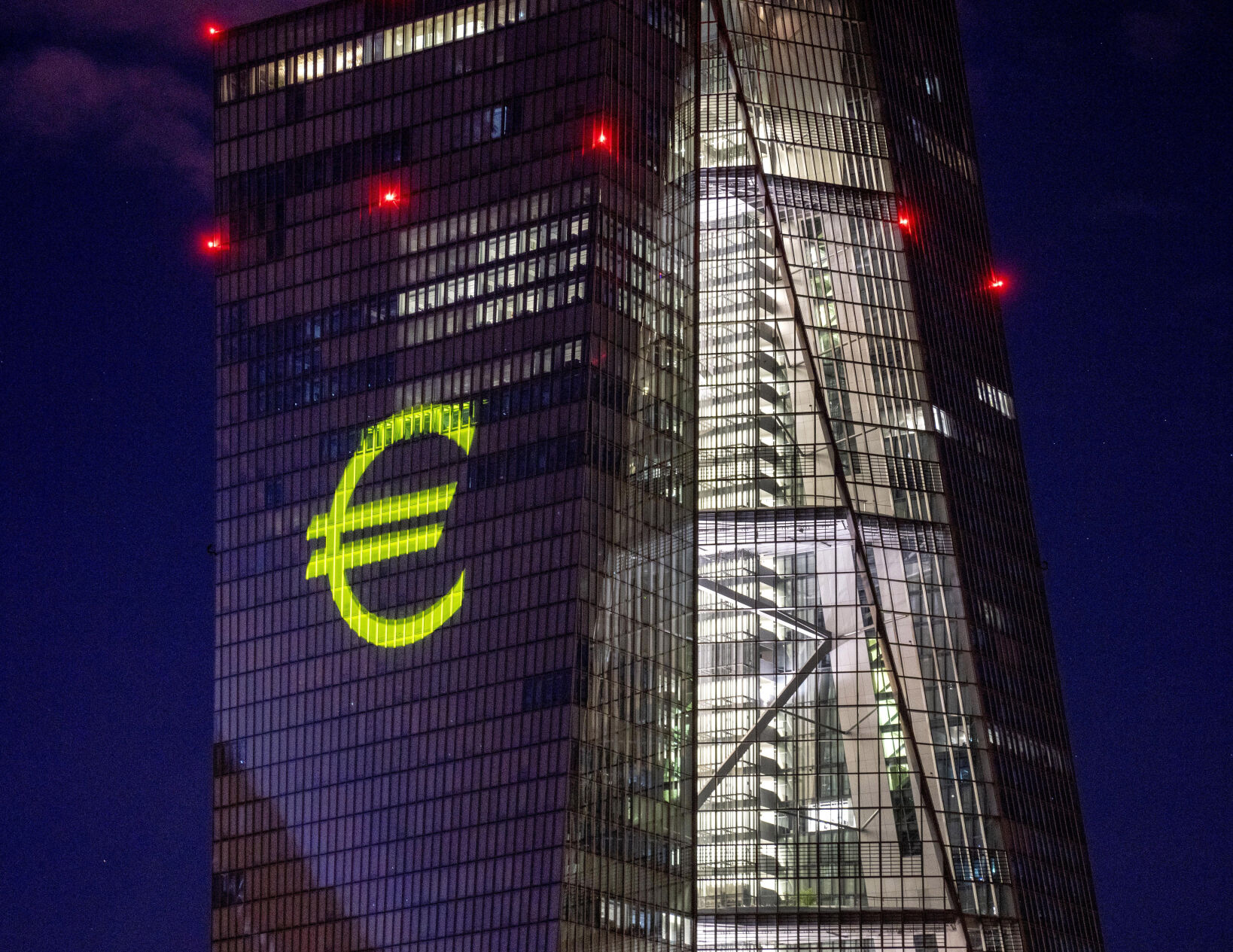 <p>FILE - A light installation is projected onto the building of the European Central Bank during a rehearsal in Frankfurt, Germany, Dec. 30, 2021. Inflation hit a new record in the 19 countries that use the euro currency, fueled by out-of-control prices for natural gas and electricity due to the war in Ukraine, the European Union statistics agency Eurostat reported Monday, Oct. 31, 2022. (AP Photo/Michael Probst, File)</p>   PHOTO CREDIT: Michael Probst - staff, AP