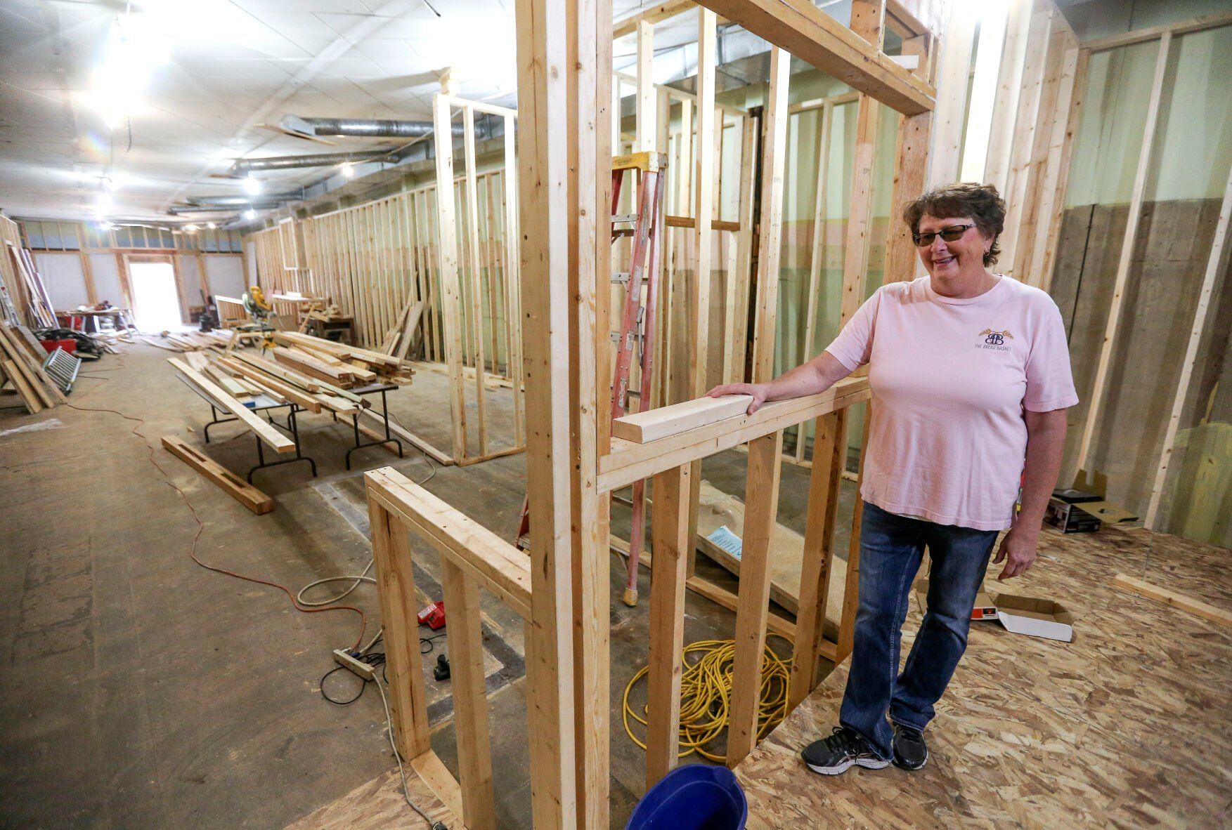 Owner Jackie Mormann stands in what will be the kitchen area of The Bread Basket located in Manchester, Iowa, on Friday, Oct. 28, 2022.    PHOTO CREDIT: Dave Kettering