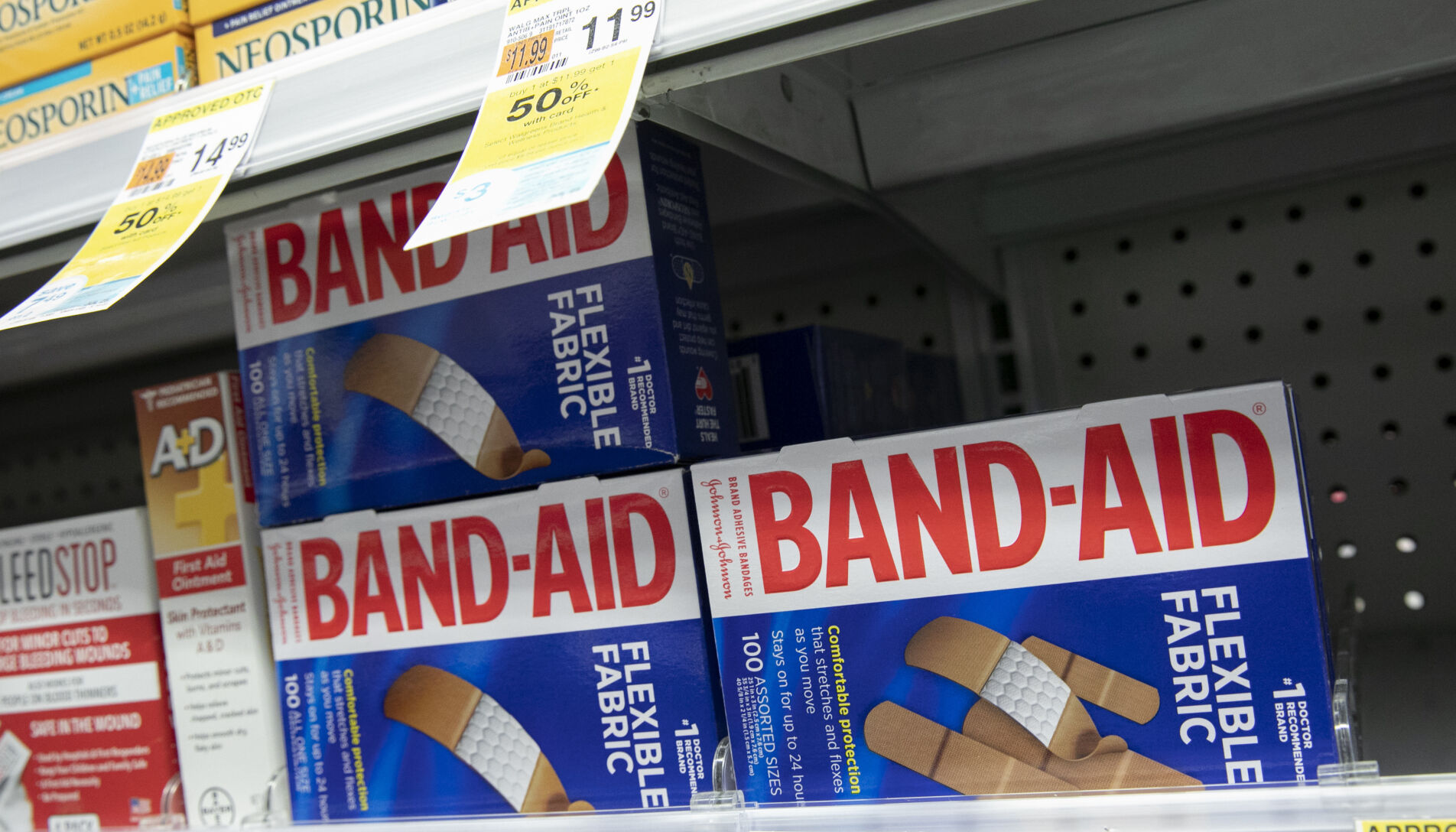 <p>FILE - Band-Aids, from Johnson & Johnson, are displayed in a pharmacy, Thursday, July 16, 2020, in New York. Johnson & Johnson topped third-quarter expectations thanks to growth in pharmaceutical sales, but the health care giant continued to tread cautiously with its outlook due to foreign exchange rates.(AP Photo/Mark Lennihan, File)</p>   PHOTO CREDIT: Mark Lennihan 