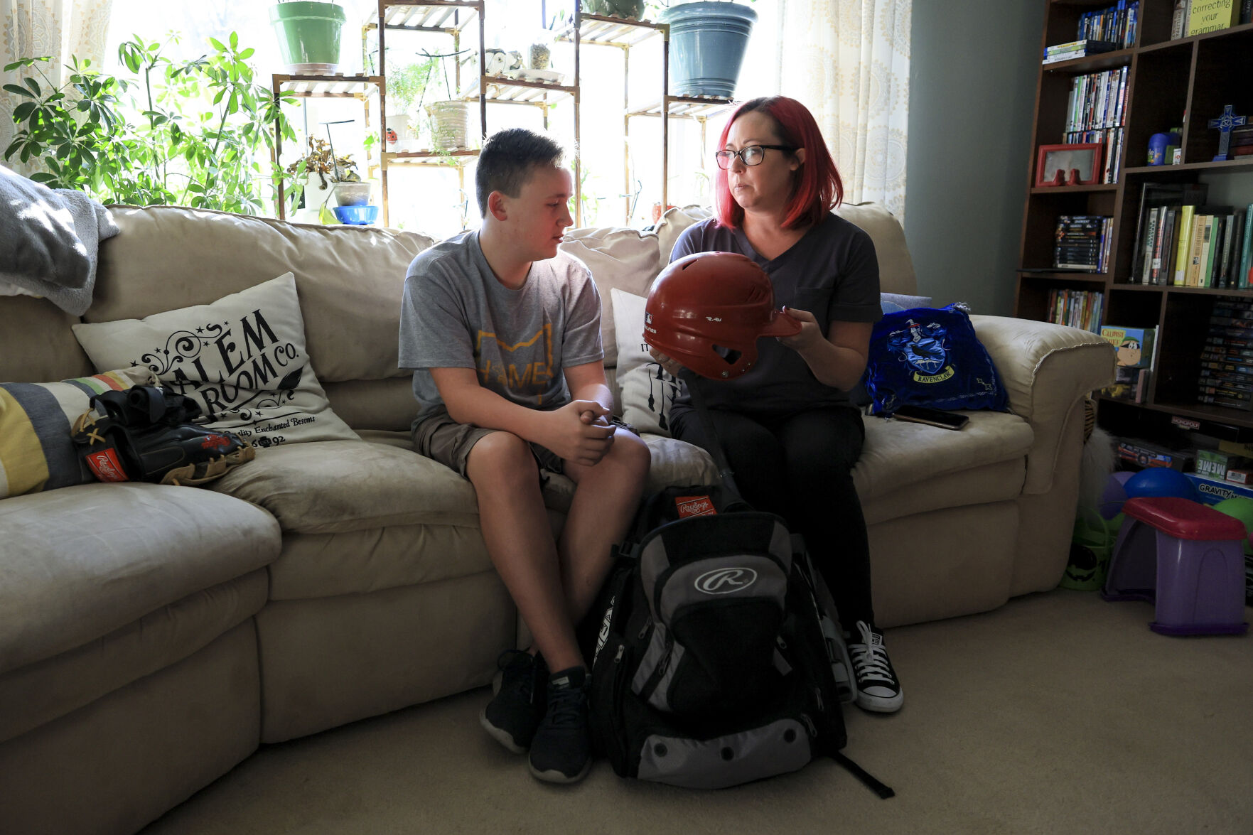 <p>Liam Kennedy, left, and his mother, Rachel, go through an equipment bag while being interviewed Friday, Oct. 28, 2022, in Monroe, Ohio. (AP Photo/Aaron Doster)</p>   PHOTO CREDIT: Aaron Doster - freelancer, FR171400 AP
