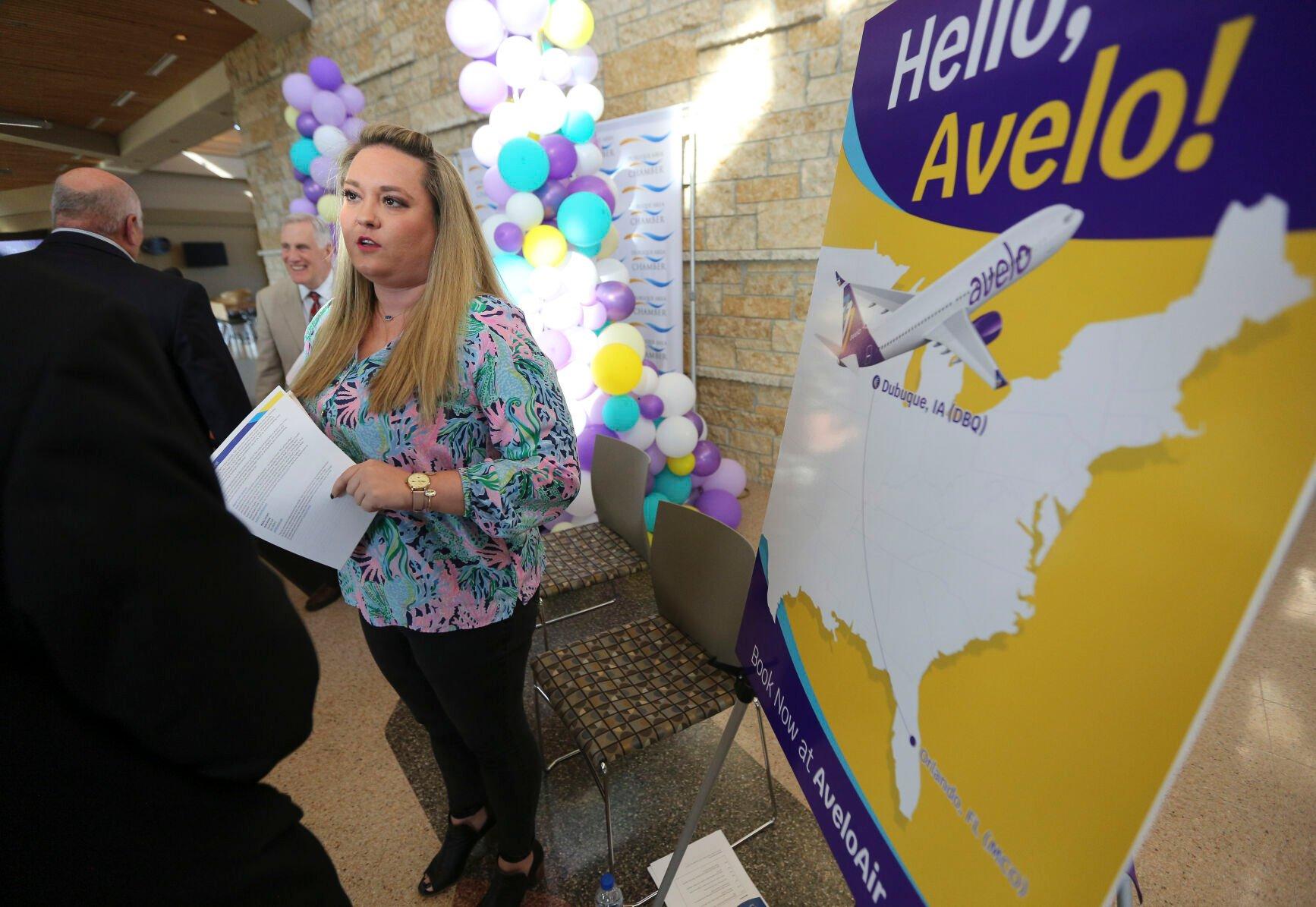 Avelo Airlines Communications Manager Courtney Goff talks to attendees after a press conference announcing the low-cost airline as the new carrier from Dubuque Regional Airport on Thursday, Nov. 3, 2022.    PHOTO CREDIT: Dave Kettering