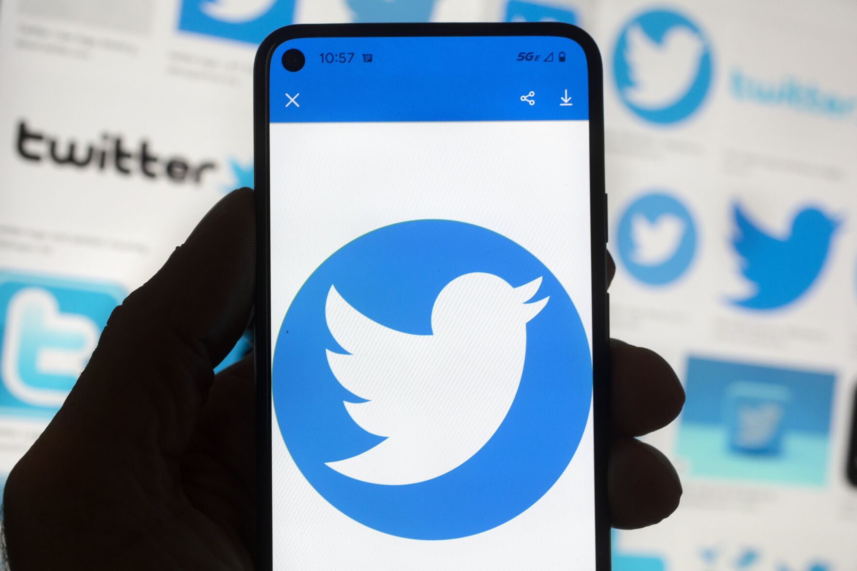 <p>The Twitter logo is seen on a cell phone, Friday, Oct. 14, 2022, in Boston. While amount of chaos is expected after a corporate takeover, as are layoffs and firings, Elon Musk’s murky plans for Twitter — especially its content moderation, misinformation and hate speech policies — are raising alarms about where one of the world’s most high-profile information ecosystems is headed. (AP Photo/Michael Dwyer)</p>   PHOTO CREDIT: Michael Dwyer - staff, AP