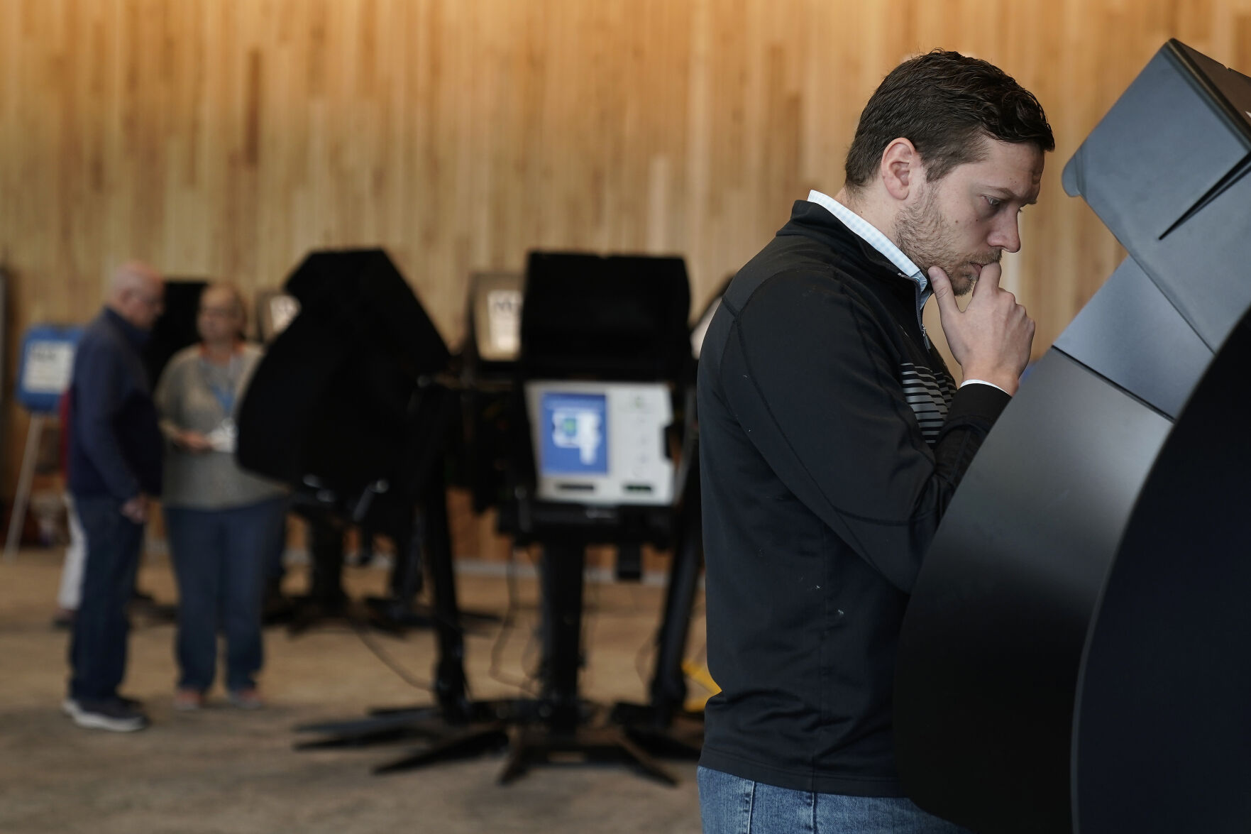 <p>Tony Bergida looks over an electronic ballot while voting early at a polling place, Thursday, Oct. 27, 2022, in Olathe, Kan. Bergida, a 27-year-old father of two and the chair of the Kansas Young Republicans, said the top issue on his mind as he cast his ballot was the economy. (AP Photo/Charlie Riedel)</p>   PHOTO CREDIT: Charlie Riedel 