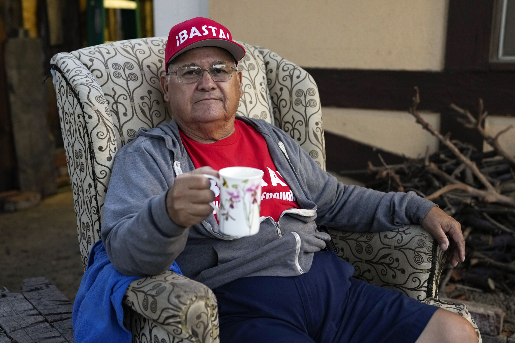 <p>Ron Flores, a Republican, sits on his porch, Thursday, Nov. 3, 2022, in Huntington Beach, Calif. Flores is retired and helps campaign for conservative candidates. (AP Photo/Ashley Landis)</p>   PHOTO CREDIT: Ashley Landis - staff, AP