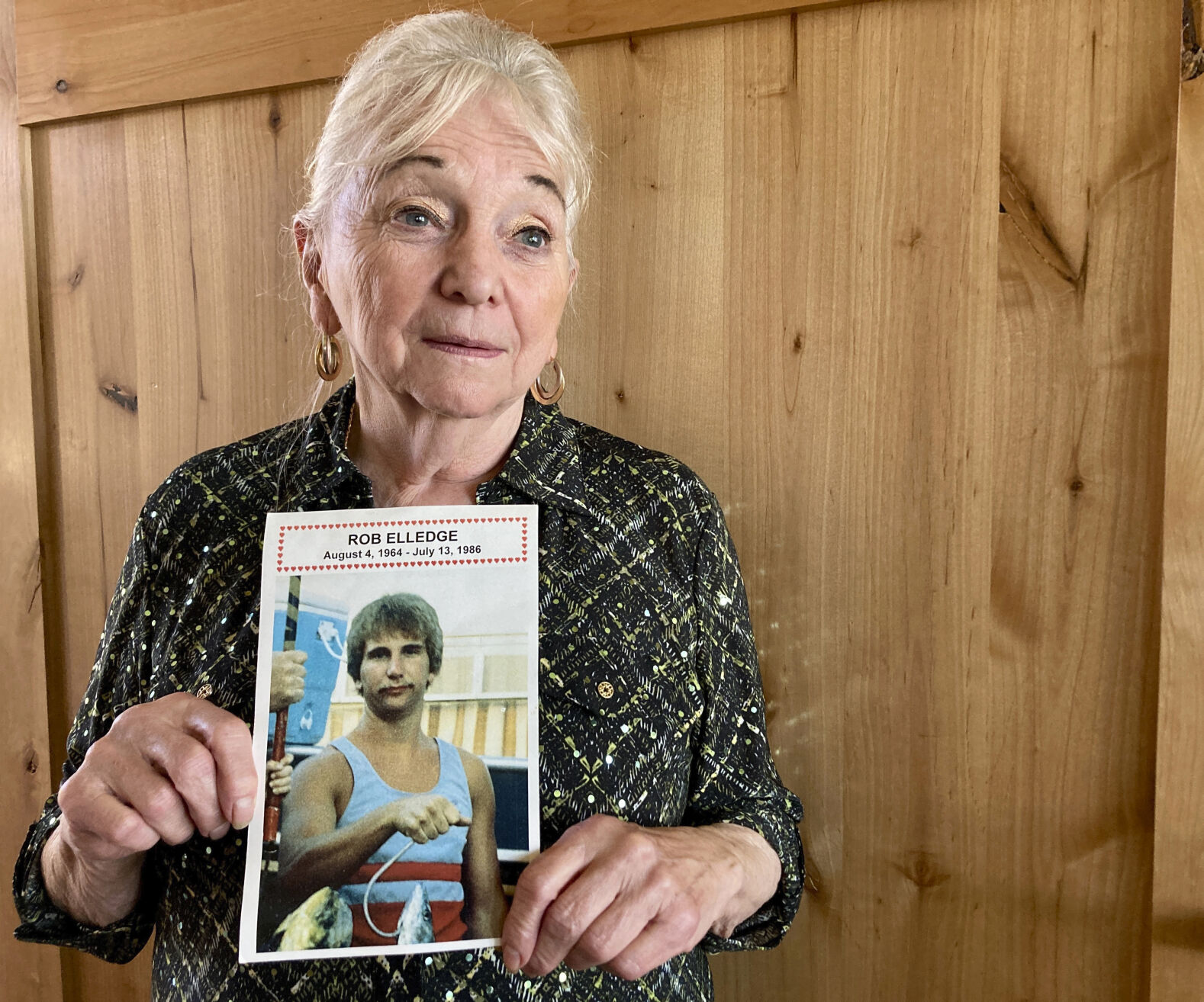<p>Mary Elledge holds a photograph of a picture taken in Oregon City, Ore., of her only son, Rob Elledge, on Oct. 27, 2022, who was murdered in 1986. Elledge, president of the Portland chapter of Parents of Murdered Children, is a registered Democrat but this November she will vote for the independent candidate for Oregon governor because she feels Democrats are too progressive on issues like bail and sentencing reform and early release. (AP Photo/Gillian Flaccus)</p>   PHOTO CREDIT: Gillian Flaccus - staff, AP