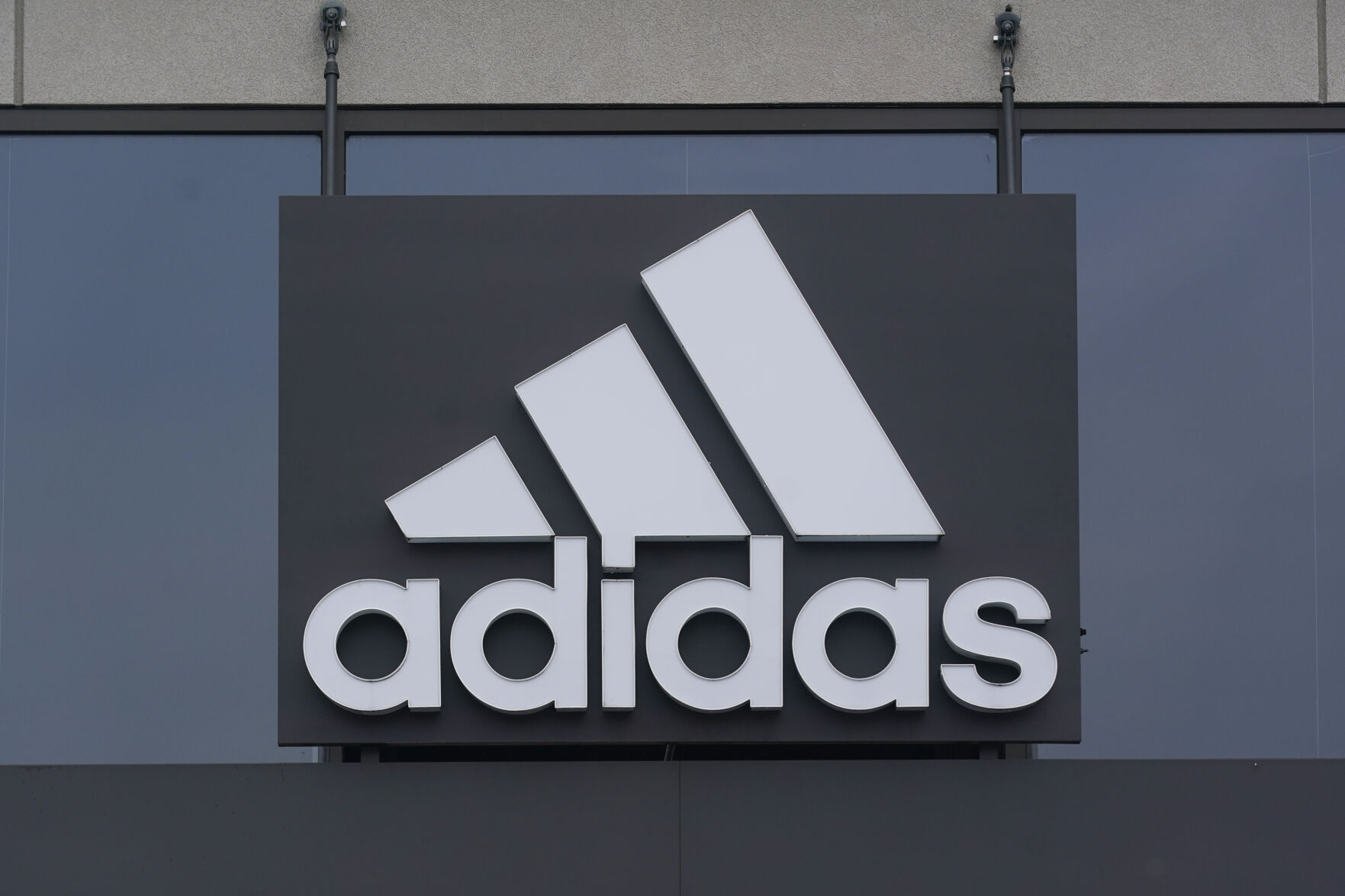 <p>A sign is displayed in front of an Adidas retail store in Paramus, N.J., Tuesday, Oct. 25, 2022. Adidas has ended its partnership with the rapper formerly known as Kanye West over his offensive and antisemitic remarks, the latest company to cut ties with Ye and a decision that the German sportswear company said would hit its bottom line. (AP Photo/Seth Wenig)</p>   PHOTO CREDIT: Seth Wenig 