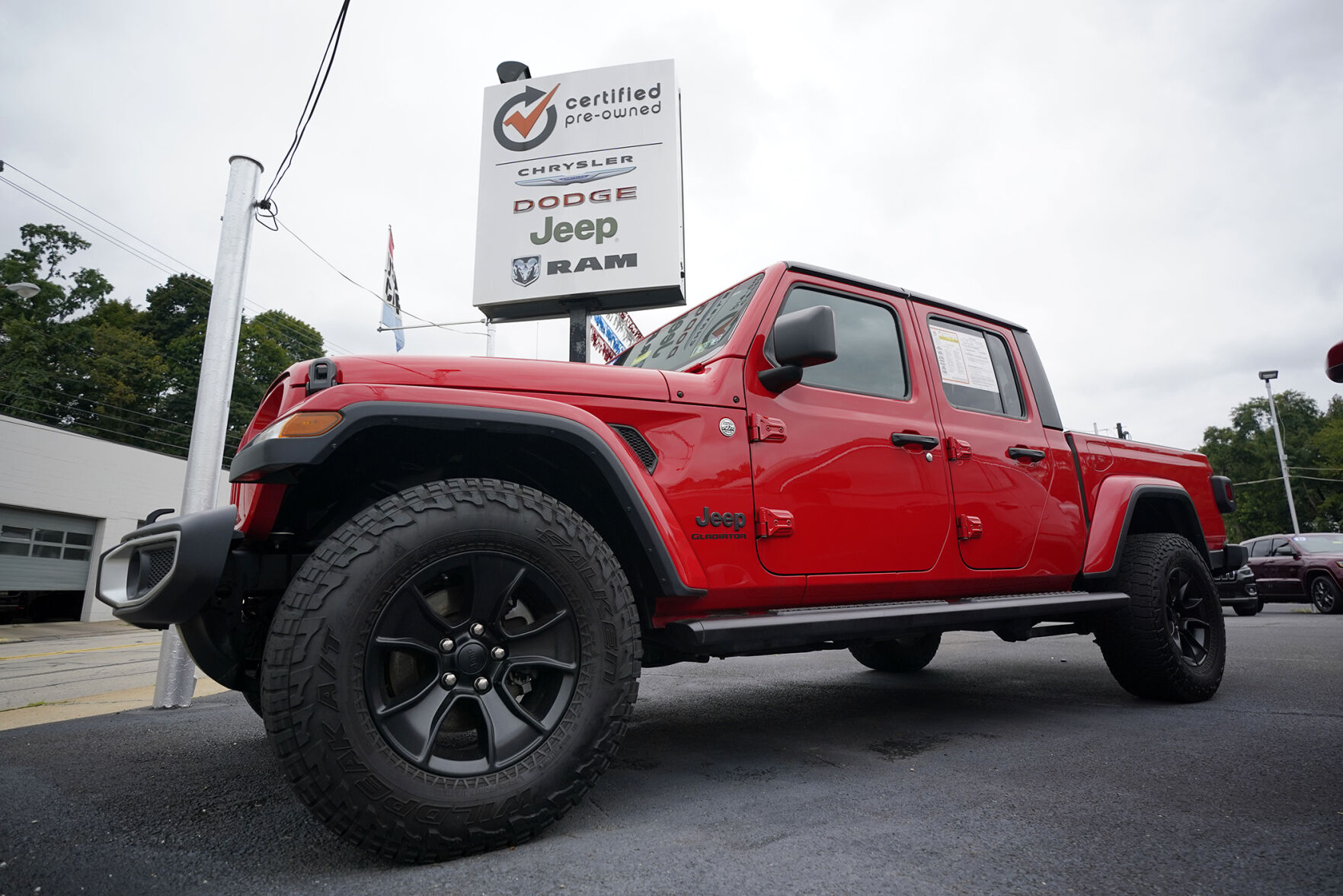 <p>File - A used 2020 Jeep is on display on a lot in Pittsburgh, Thursday, Sept. 29, 2022. Price increases moderated in the United States last month, Thursday, Nov. 10, in the latest sign that the inflation pressures that have gripped the nation might be easing as the economy slows and consumers grow more cautious. (AP Photo/Gene J. Puskar, File)</p>   PHOTO CREDIT: Gene J. Puskar - staff, AP
