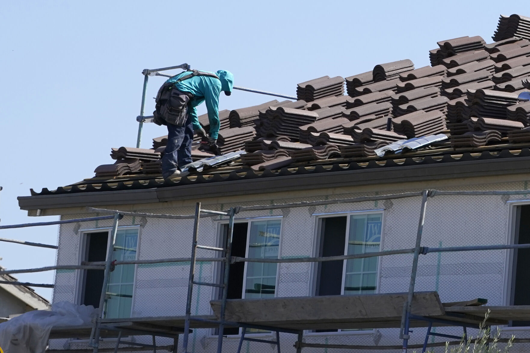 <p>File - Work is performed on the roof of a home under construction in Folsom, Calif. Wednesday, Oct. 12, 2022. Home prices are slowing sharply compared with a year ago and have begun to fall on a monthly basis.(AP Photo/Rich Pedroncelli)</p>   PHOTO CREDIT: Rich Pedroncelli - staff, AP