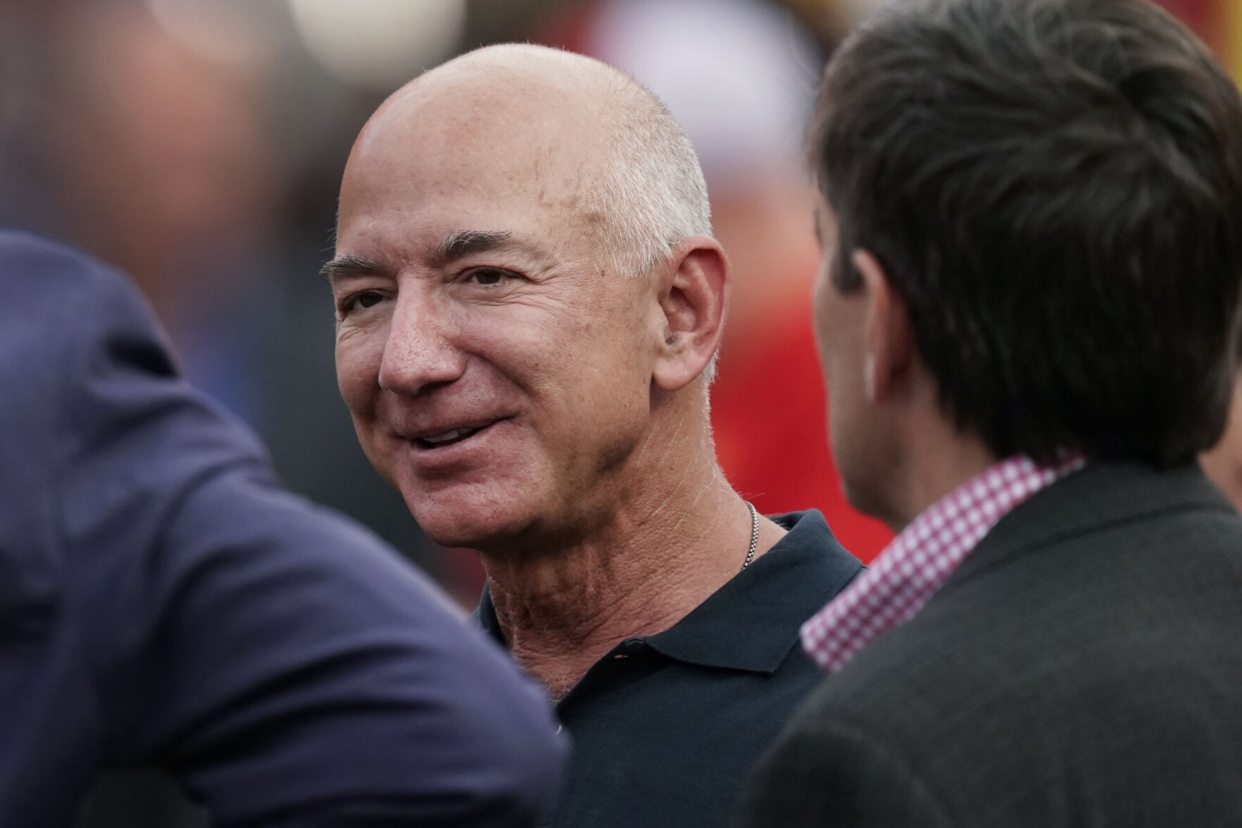 <p>FILE - Amazon founder Jeff Bezos is seen on the sidelines before the start of an NFL football game on Sept. 15, 2022, in Kansas City, Mo. A former housekeeper for Bezos says she and other employees suffered unsafe working conditions that included being forced to climb out a laundry room window to get to a bathroom. In a lawsuit filed in Seattle this week, a longtime housekeeper claims she was discriminated and retaliated against when she complained about a lack of rest breaks or an area where staff could eat. (AP Photo/Charlie Riedel, File)</p>   PHOTO CREDIT: Charlie Riedel 