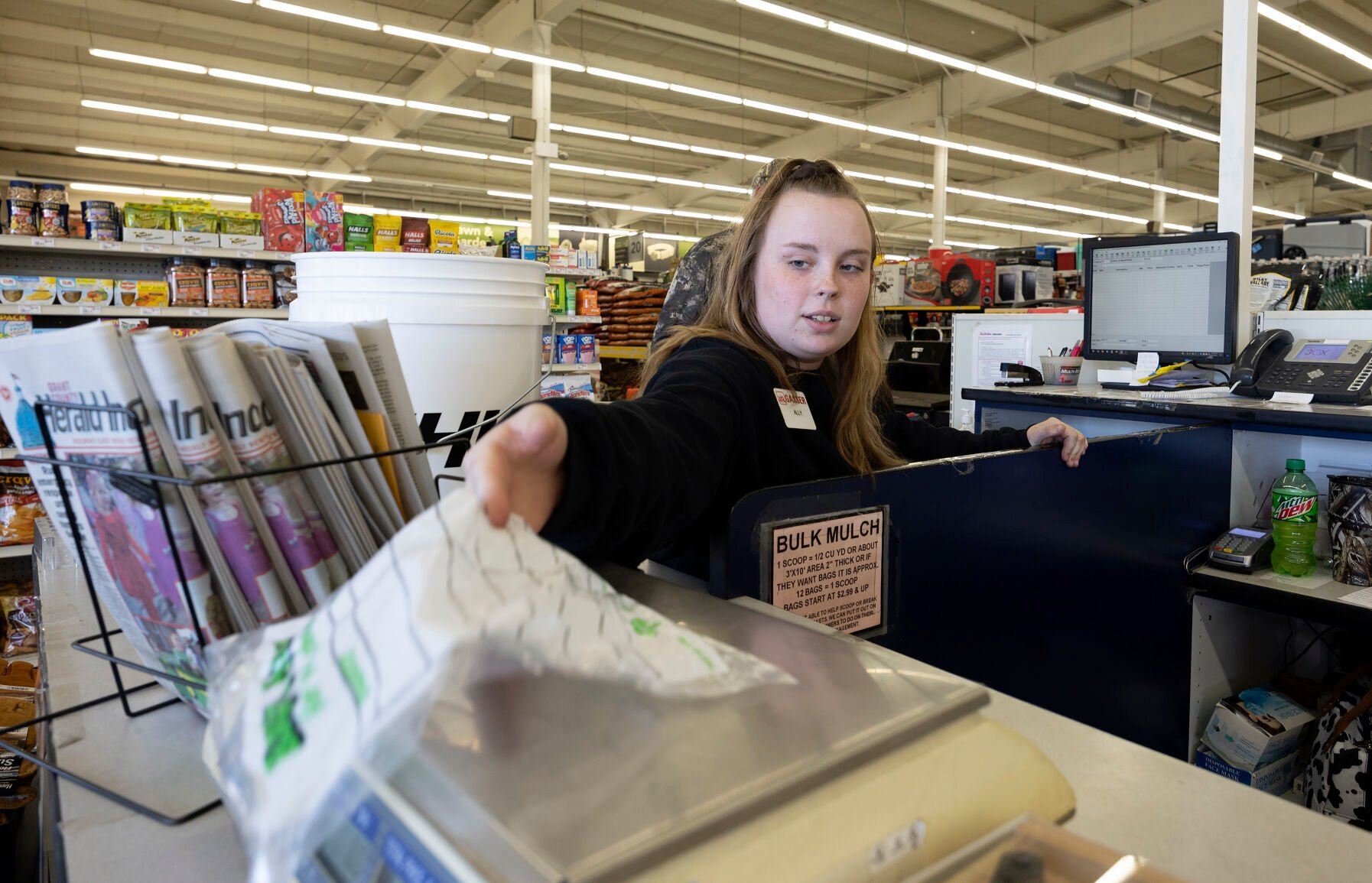 Cashier Ally Lauth weighs hardware during checkout at Gasser True Value in Lancaster, Wis.    PHOTO CREDIT: Stephen Gassman