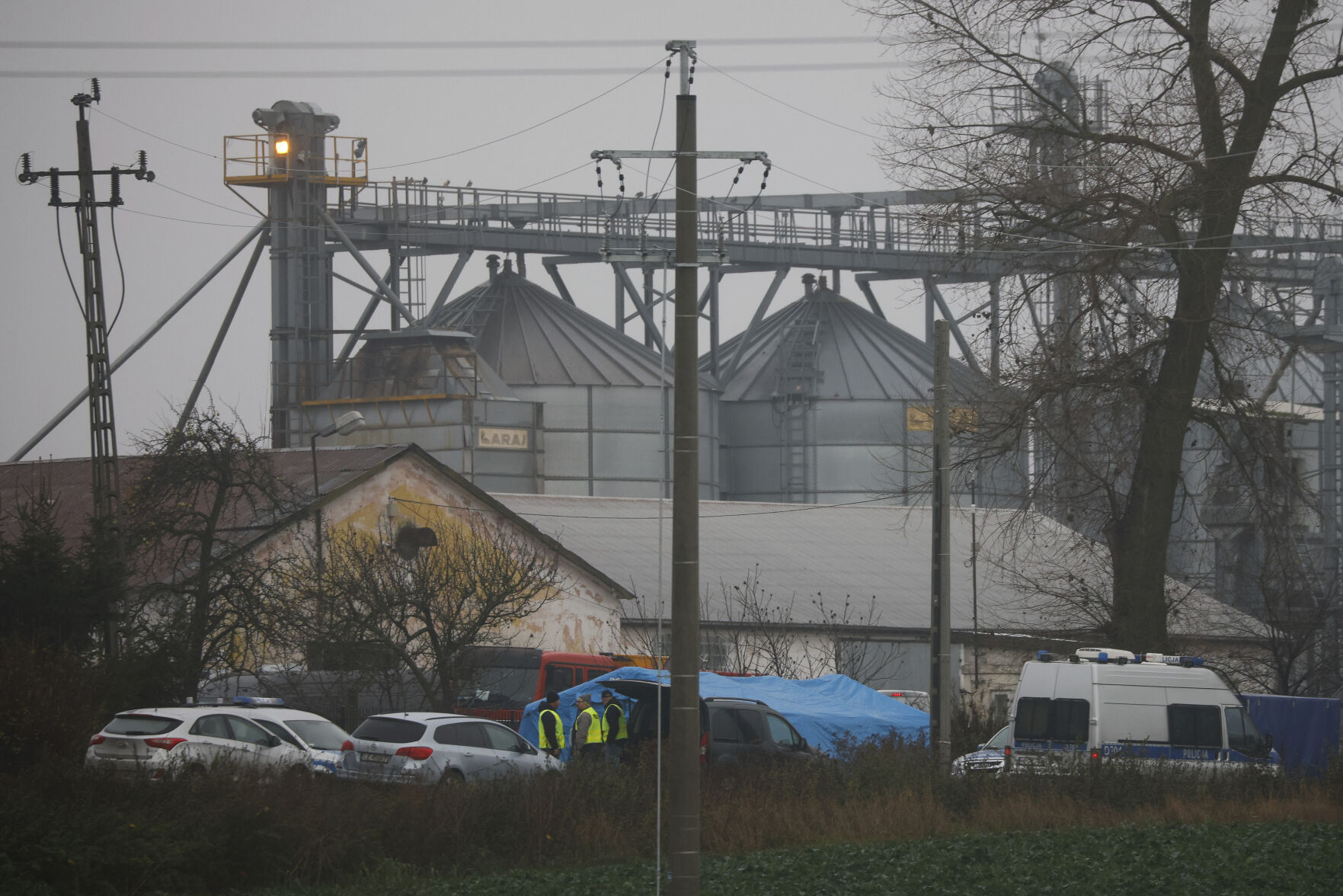 <p>Police officers work outside a grain depot where, according to the Polish government, an explosion of a Russian-made missile killed two people in Przewodow, Poland, Wednesday, Nov. 16, 2022. Poland said Wednesday that a Russian-made missile fell in the country’s east, killing two people, though U.S. President Joe Biden said it was "unlikely” it was fired from Russia. (AP Photo/Michal Dyjuk)</p>   PHOTO CREDIT: Michal Dyjuk 