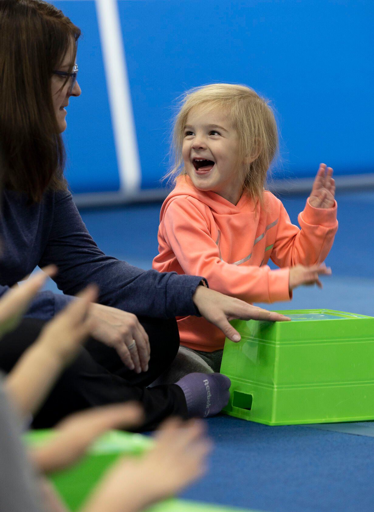Marissa Tyson, 3, drums on a container as she looks at her mom, Nicole, during a Mommy and Me Music Class at Badger Elite Athletics in Shullsburg, Wis.    PHOTO CREDIT: Stephen Gassman, Telegraph Herald