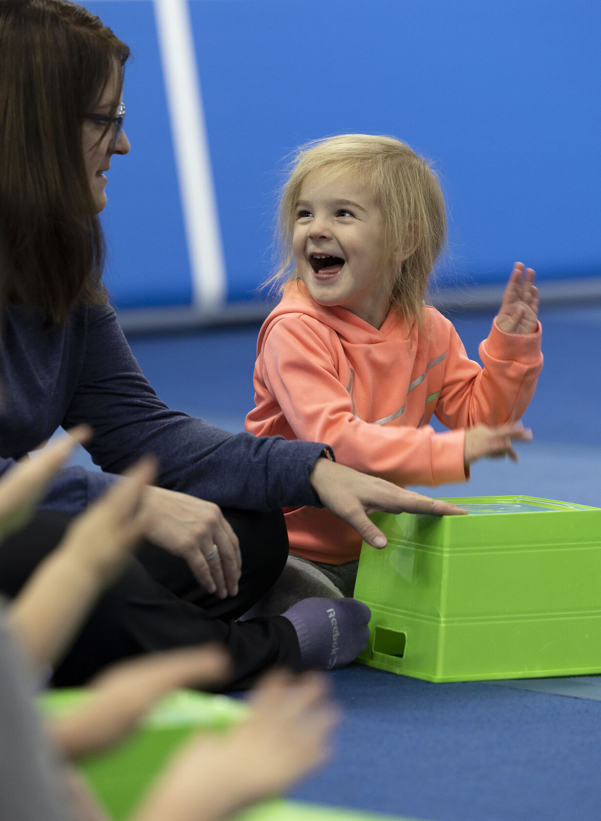 Marissa Tyson, 3, drums on a container as she looks at her mom, Nicole, during a Mommy and Me Music Class at Badger Elite Athletics in Shullsburg, Wis.    PHOTO CREDIT: Stephen Gassman, Telegraph Herald