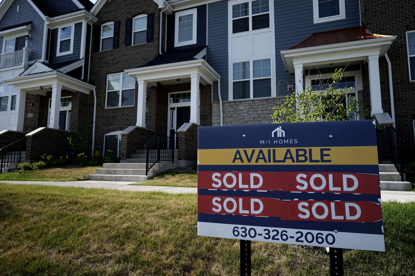 <p>FILE - An advertising sign for building land stands in front of a new home construction site in Northbrook, Ill., Wednesday, June 23, 2021. Mortgage buyer Freddie Mac reports on key 30-year mortgage rates on Wednesday, Nov. 23, 2022. (AP Photo/Nam Y. Huh, File)</p>   PHOTO CREDIT: Nam Y. Huh - staff, AP