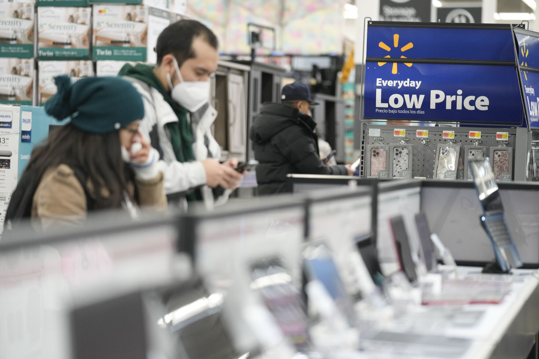 <p>FILE - Signs advertise deals and low prices at a Walmart in Secaucus, N.J., Tuesday, Nov. 22, 2022. On Tuesday the Conference Board reports on U.S. consumer confidence for November. (AP Photo/Seth Wenig, File)</p>   PHOTO CREDIT: Seth Wenig 