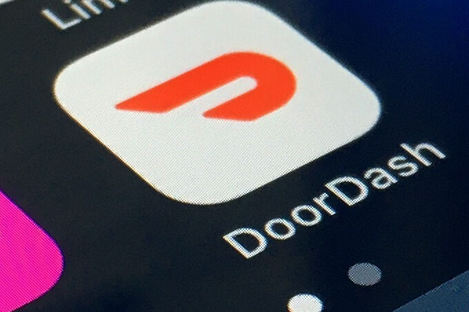 <p>FILE - In this Feb. 27, 2020, file photo, the DoorDash app is shown on a smartphone in New York. DoorDash is cutting more than 1,200 corporate jobs, saying it hired too many people when demand for its services increased during the COVID-19 pandemic. Tony Xu said in a message to employees on Wednesday, Nov. 30, 2022 that DoorDash was undersized before the pandemic and sped up hiring to catch up with its growth. (AP Photo, File)</p>   PHOTO CREDIT: Uncredited - staff, ap