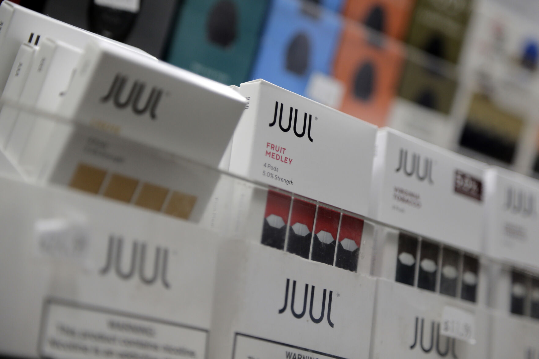 <p>FILE - Juul products are displayed at a smoke shop in New York, on Dec. 20, 2018. Embattled vaping company Juul Labs announced layoffs Thursday, Nov. 10, 2022, as the company tries to weather growing setbacks to its electronic cigarette business, including lawsuits, government bans and increasing competition. (AP Photo/Seth Wenig, File)</p>   PHOTO CREDIT: Seth Wenig - staff, AP